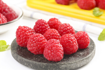 Fresh Red Raspberries on Stone Plate - Healthy Organic Berries with Shallow Depth of Field