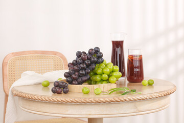 Fresh Grape Juice with Purple and Green Grapes on Wooden Table - Summer Drink and Healthy Lifestyle