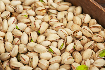 Fresh Salted Pistachios in Wooden Bowl - Healthy Daily Snack Nuts