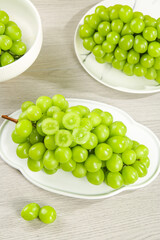 Fresh Green Grapes in White Bowls on Wooden Table - Healthy Organic Fruit