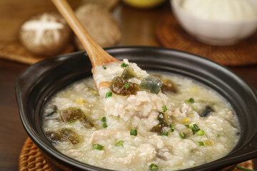 Traditional Chinese Congee Rice Porridge with Century Eggs and Scallions - Delicious Asian...