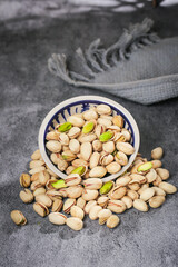 Fresh Pistachios in Bowl with Athletic Shoes - Healthy Snack for Active Lifestyle