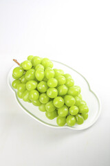 Fresh Green Grapes Bunch on White Plate - Healthy Organic Fruit Snack