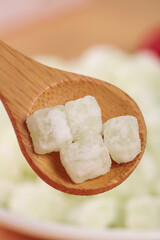 Handmade Winter Melon Candy Preserves on Wooden Spoon - Traditional Chinese Confection Display