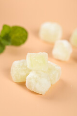 Handmade Candied Melon Cubes with Crystallized Sugar Coating and Fresh Mint