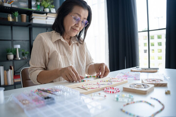 Senior mature older asian woman Art hobby handmade making beads jewellery accessories handcraft...