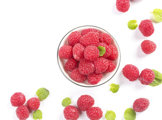 Fresh Red Raspberries in Glass Bowl with Mint Leaves on White Background