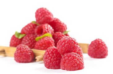 Fresh Red Raspberries on White Background with Wooden Spoon - Healthy Organic Berries