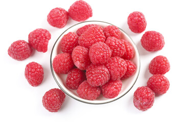 Fresh Red Raspberries in Glass Bowl on White Background with Scattered Berries