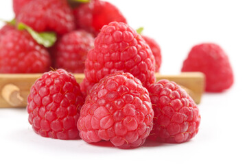 Fresh Red Raspberries on White Background with Wooden Basket - Healthy Summer Fruit Photography