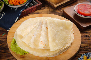 Fresh Wheat Tortillas on Wooden Board with Vegetables and Sauce for Mexican Cooking