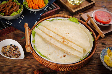 Fresh Wheat Flour Tortillas with Mixed Grains and Vegetables for Burrito Preparation on Rustic Wooden Table
