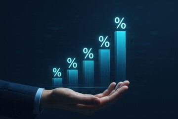 Obraz premium Hand holding rising percentage bar graph symbolizing financial growth and success