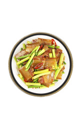 Wood-fired smoked bacon dish with garlic and scallions on traditional ornate plate