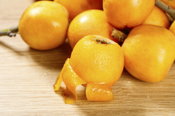 Fresh Loquat Fruits from Panzhihua Yunnan Mountain Region on Wooden Board