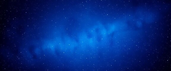 Obraz premium Deep indigo cosmos, glittering stardust scattered across a velvety blue backdrop, cosmos, stars