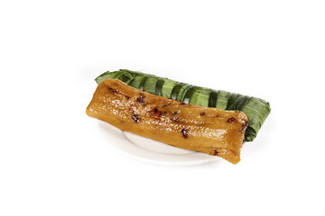 Asian Rice Dumpling in Banana Leaf Wrapping on White Background