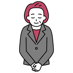 お辞儀をする中年のスーツの女性