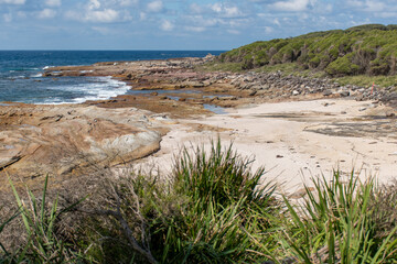 Beautiful ocean and rocky sandstone coastline view. Travel destination. Royal National Park, NSW, Australia. Jibbon Loop Track