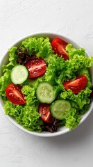 Fresh Garden Salad with Lettuce, Tomato, and Cucumber on White Background