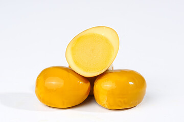 Golden Yellow Tropical Fruits Cut in Half on White Background