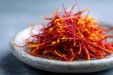 Fototapeta premium Macro of saffron threads on ceramic plate
