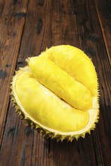 Fresh Durian Fruit from Thailand with Yellow Flesh on Wooden Background