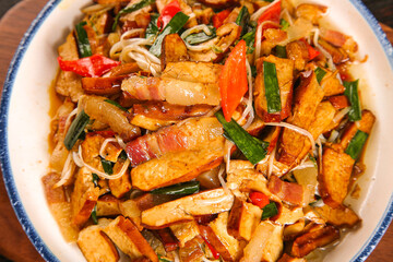 Spiced Tofu and Vegetable Stir-Fry with Dried Bacon on White Plate