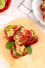 Xinjiang Stuffed Red Dates with Walnuts and Dried Fruit on Wooden Cutting Board