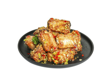 Glazed Pork Ribs with Garlic and Herbs on Black Plate - Delicious BBQ Meat Dish