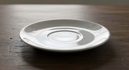 Empty white saucer, minimalist presentation on rustic wooden surface