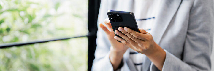 Woman use smart phone at workplace for online web internet search
