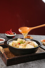 Braised Beef Brisket Chunks with White Radish in Cast Iron Pan - Traditional Asian Comfort Food
