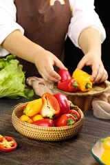 Chef Preparing Fresh Colorful Bell Peppers in Kitchen with Red Yellow Sweet Peppers