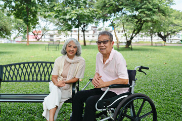 Senior Asian couple happy in park spending time together