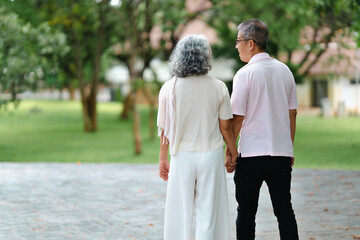 Senior Asian couple enjoying time together in park