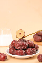 Xinjiang Dried Jujube Dates on Plate with Tweezers Showing Cross Section