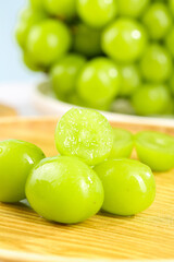 Fresh Green Grapes in Bright Sunshine on Wooden Board - Healthy Fruit Photography