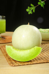 Fresh Jade Melon Slice with Cream Flesh on Wooden Table - Healthy Summer Fruit Photography