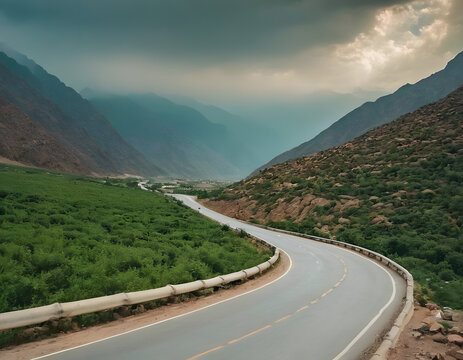 Beautiful photography of a highway, with green mountains in Pakistan.