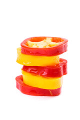 Colorful Fresh Red and Yellow Bell Pepper Slices Stacked on White Background