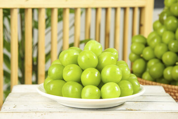 Fresh Green Grapes on White Plate in Natural Sunshine - Healthy Fruit Harvest