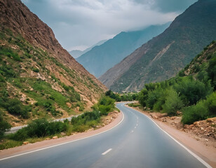 Naklejka premium Beautiful photography of a highway, with green mountains in Pakistan.A road to the mountains.