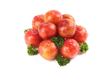 Fresh Red Plums with Water Droplets and Parsley Garnish on White Background