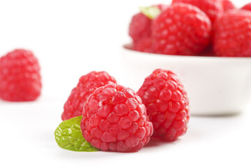 Fresh Red Raspberries with Mint Leaf on White Background