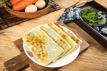 Handmade Leek Pancakes with Fresh Vegetables and Eggs on Rustic Wooden Kitchen Table