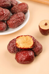 Red Xinjiang Ruoqiang Jujube Dates - Premium Chinese Dried Fruit in Bowl on Wood Background