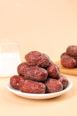 Xinjiang Ruoqiang Dried Red Jujube Dates on White Plate - Chinese Traditional Superfood