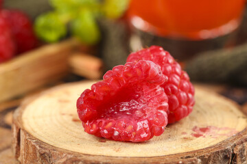 Fresh Red Raspberries on Natural Wood with Mixed Fruits Background