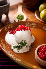 Chiles en Nogada, a typical Mexican dish. Poblano chile stuffed with meat and fruit, topped with a walnut, parsley, and pomegranate sauce. A tradition during Mexican national holidays.